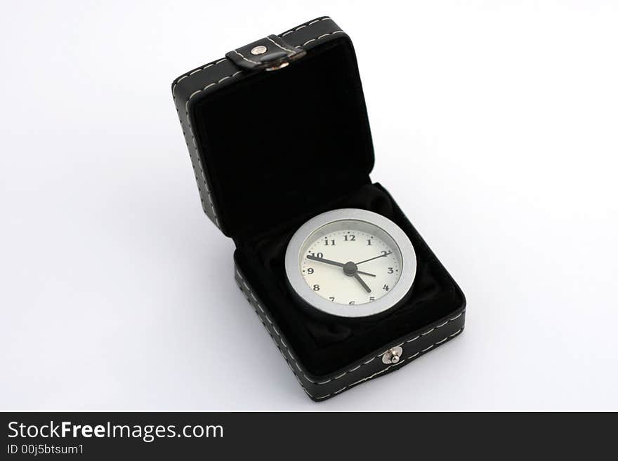 A small clock near the black box. A small clock near the black box