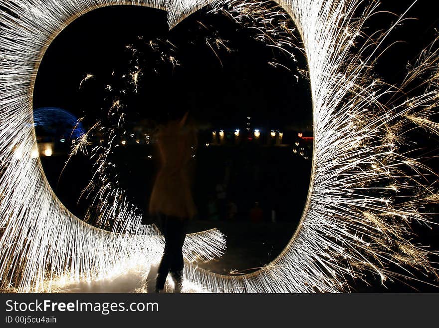 Fire show on night sky background