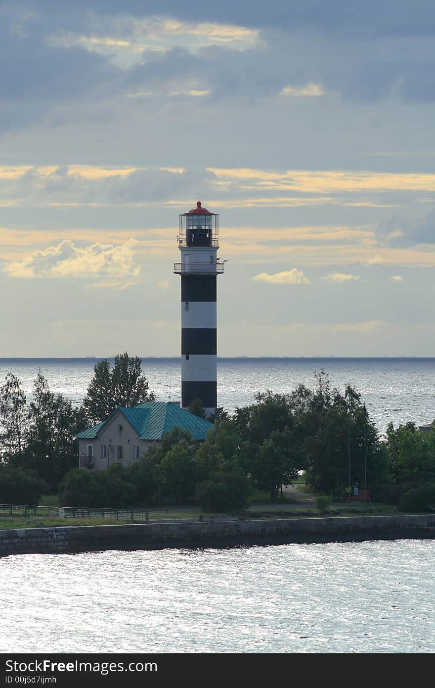 Lighthouse on pier in the sea