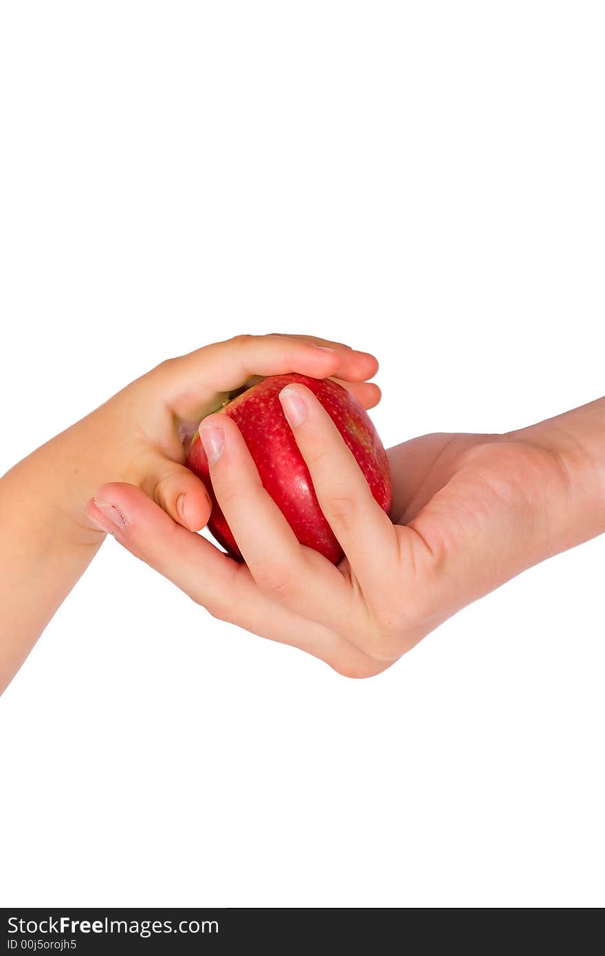 The girl treats the child with a red apple