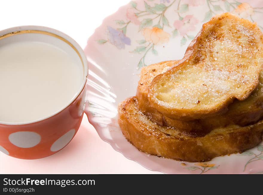 Toast and milk on a china plate