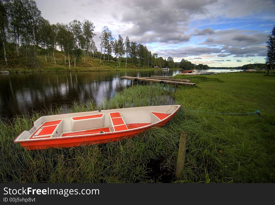 Norwegian river scenic, evening colours, red boat in the foreground.

<a href='http://www.dreamstime.com/beauty-of-norway-rcollection5045-resi208938' STYLE='font-size:13px; text-decoration: blink; color:#FF0000'><b>BEAUTY OF NORWAY COLLECTION »</b></a>. Norwegian river scenic, evening colours, red boat in the foreground.

<a href='http://www.dreamstime.com/beauty-of-norway-rcollection5045-resi208938' STYLE='font-size:13px; text-decoration: blink; color:#FF0000'><b>BEAUTY OF NORWAY COLLECTION »</b></a>