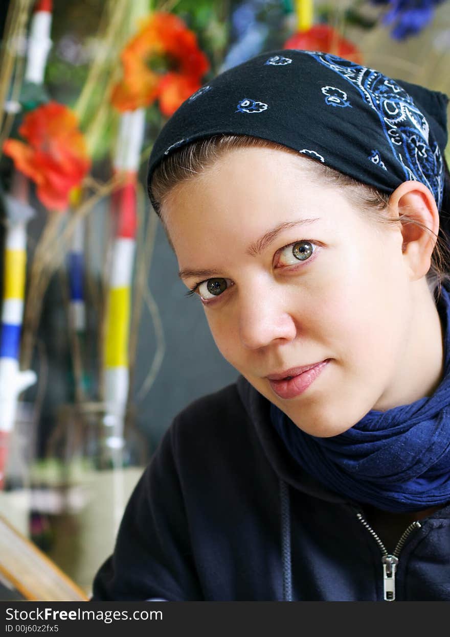 Young Woman Sitting In A Cafe