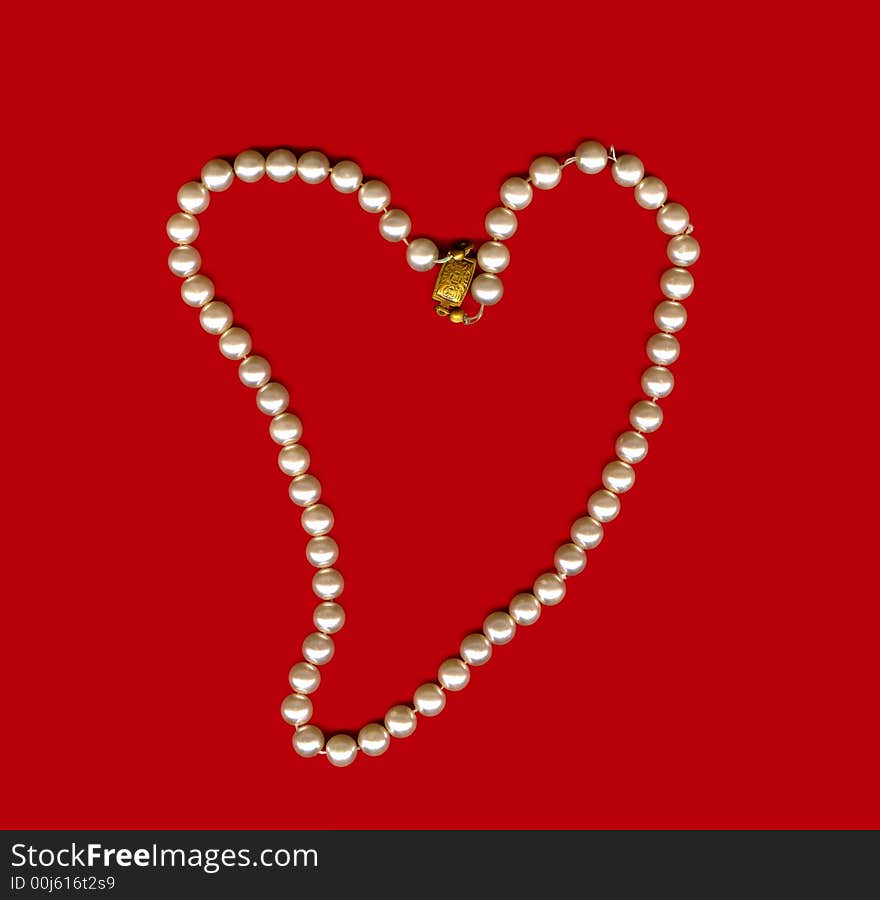 Perls heart on a red background