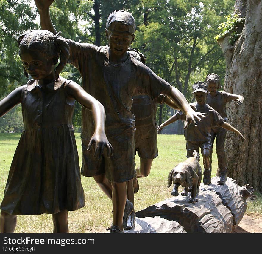 Statue of Children on Log