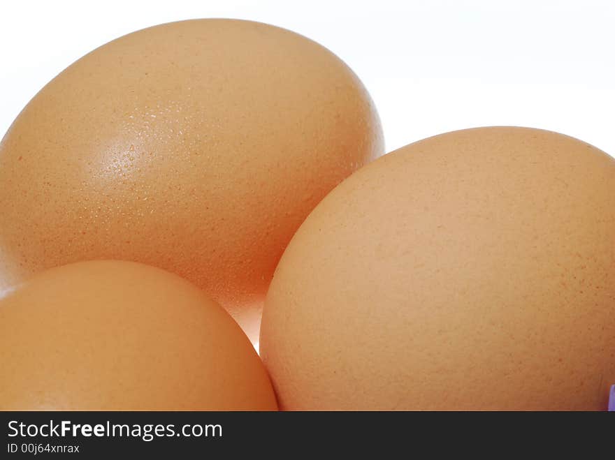 Brown eggs on white background