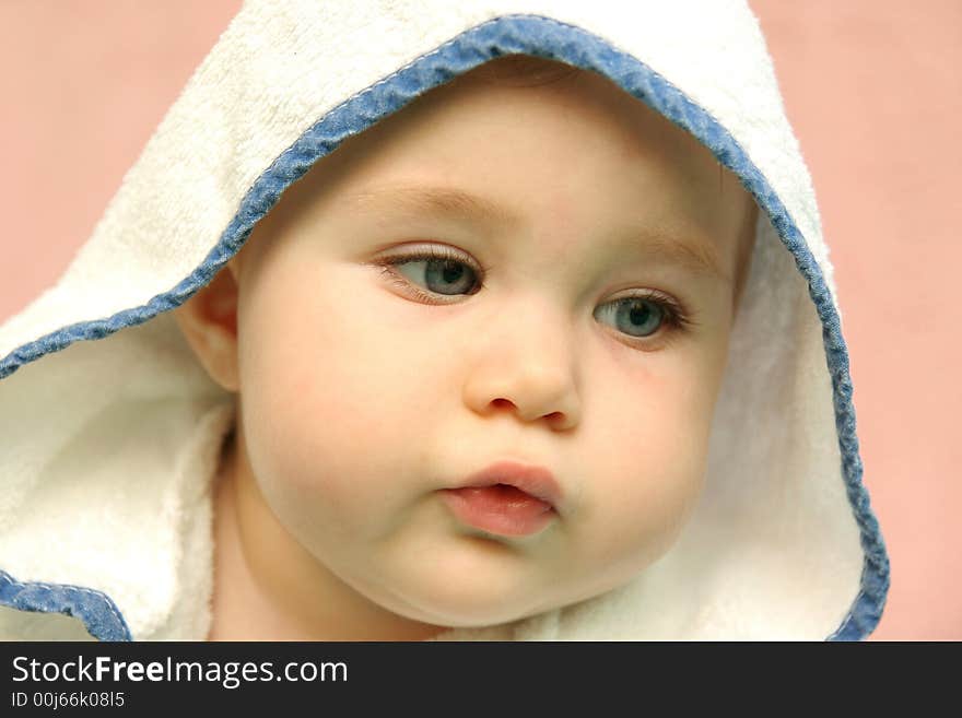 Portrait of a baby with hood