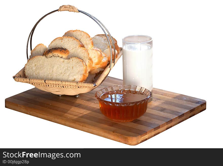 An image of bread in tray and milk in glass. An image of bread in tray and milk in glass