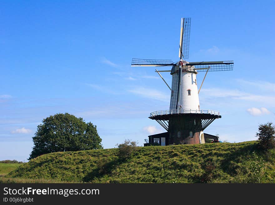 Dutch windmill against a blue sky