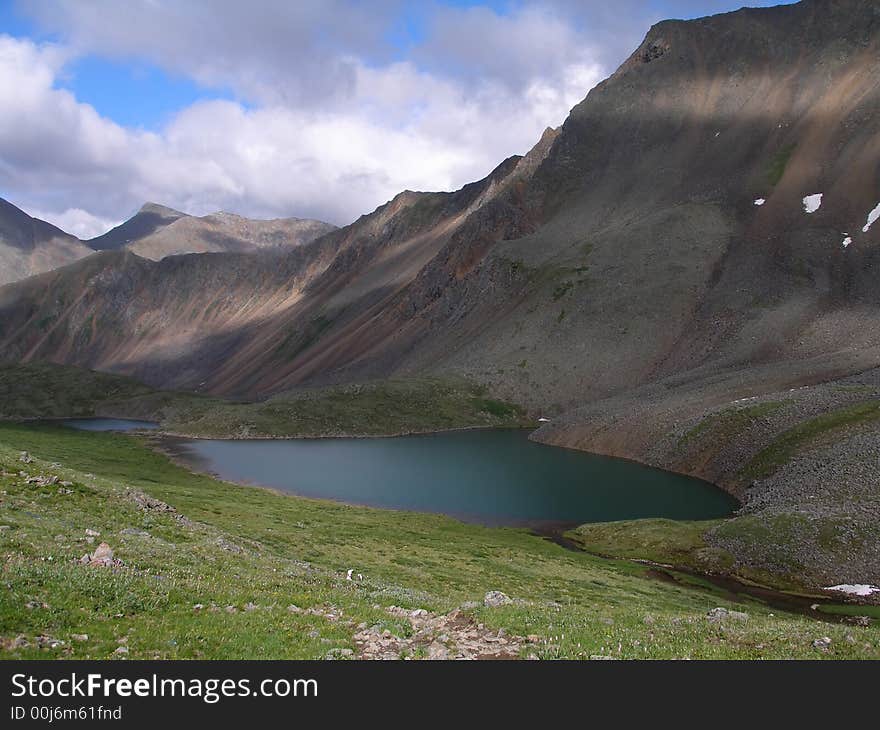 Mountain lake, landscape, high mountains, nature, wilderness, Siberia, Russia. Mountain lake, landscape, high mountains, nature, wilderness, Siberia, Russia