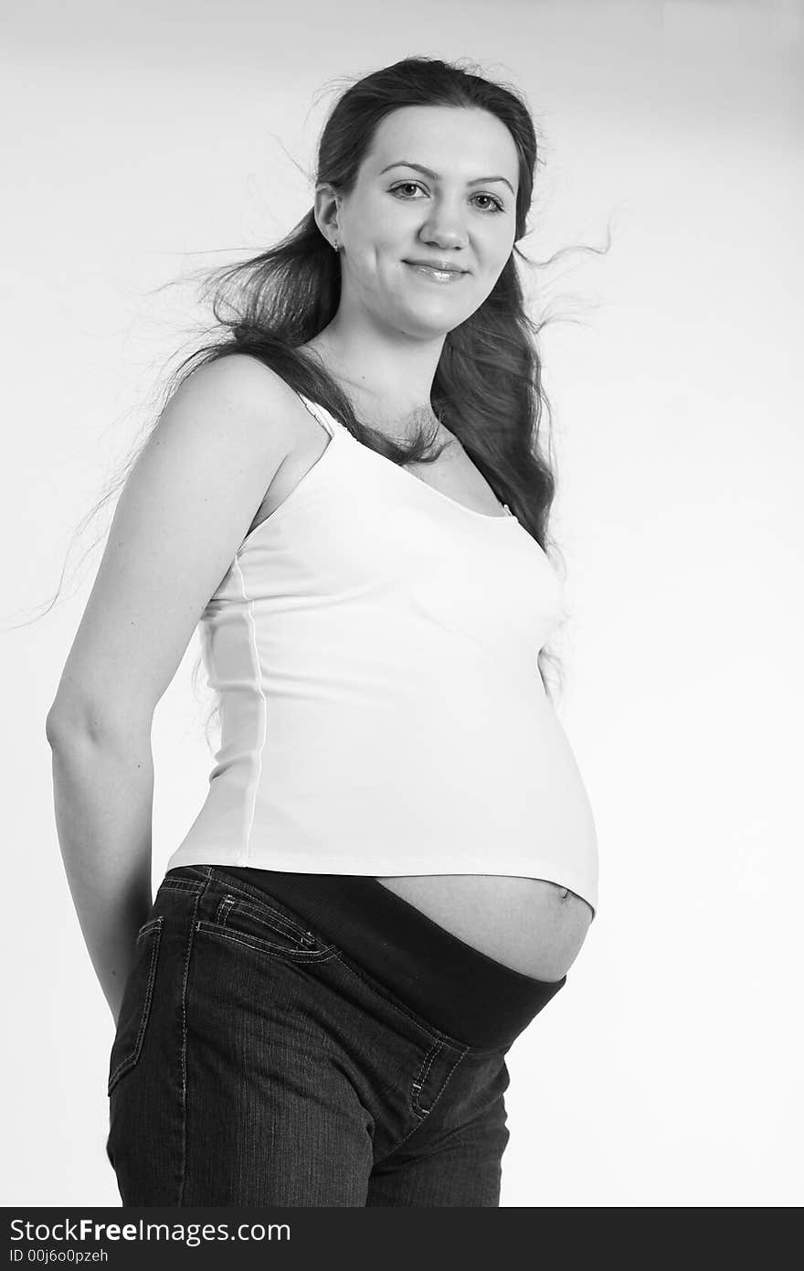 Black and white portrait of smiling pregnant