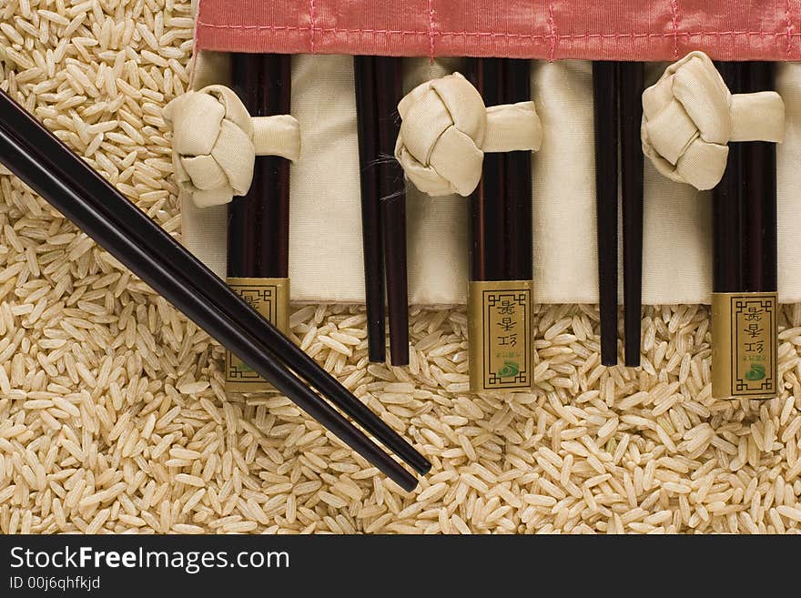 Brown Rice And Chopsticks In S