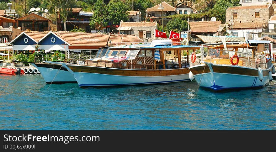 Three boats near little mediterannean town