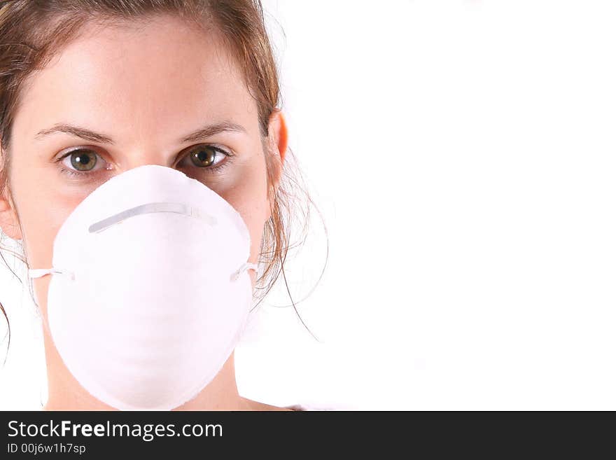 A young female doctor with her face mask on. This is a highkey image!. A young female doctor with her face mask on. This is a highkey image!