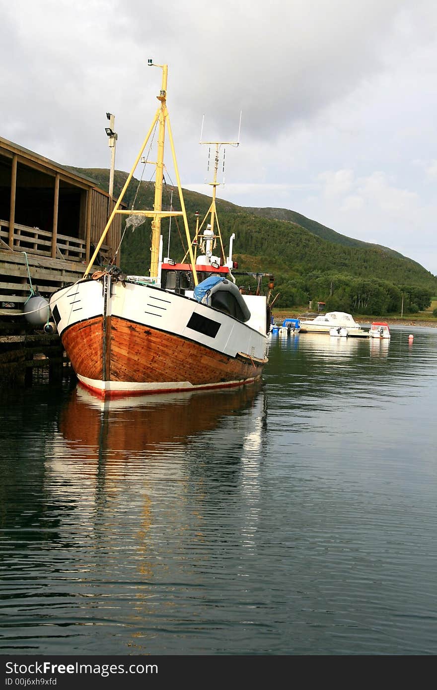 Old wooden shrimp trawler on a dock