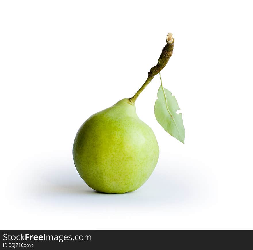 Green pear with leaf on white background