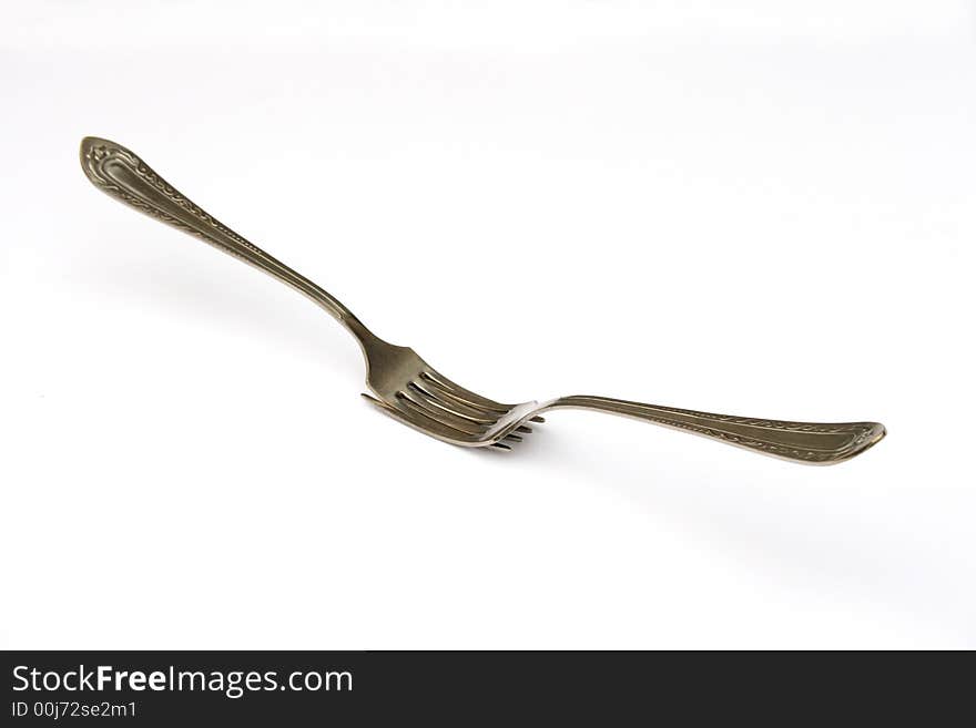 On a photo of a fork. A photon a white background.