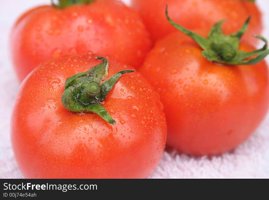 On a photo three red tomatoes. On a photo three red tomatoes.