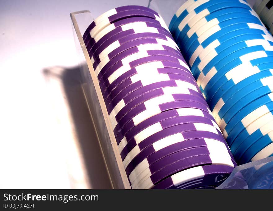 A box with some poker chips. A box with some poker chips