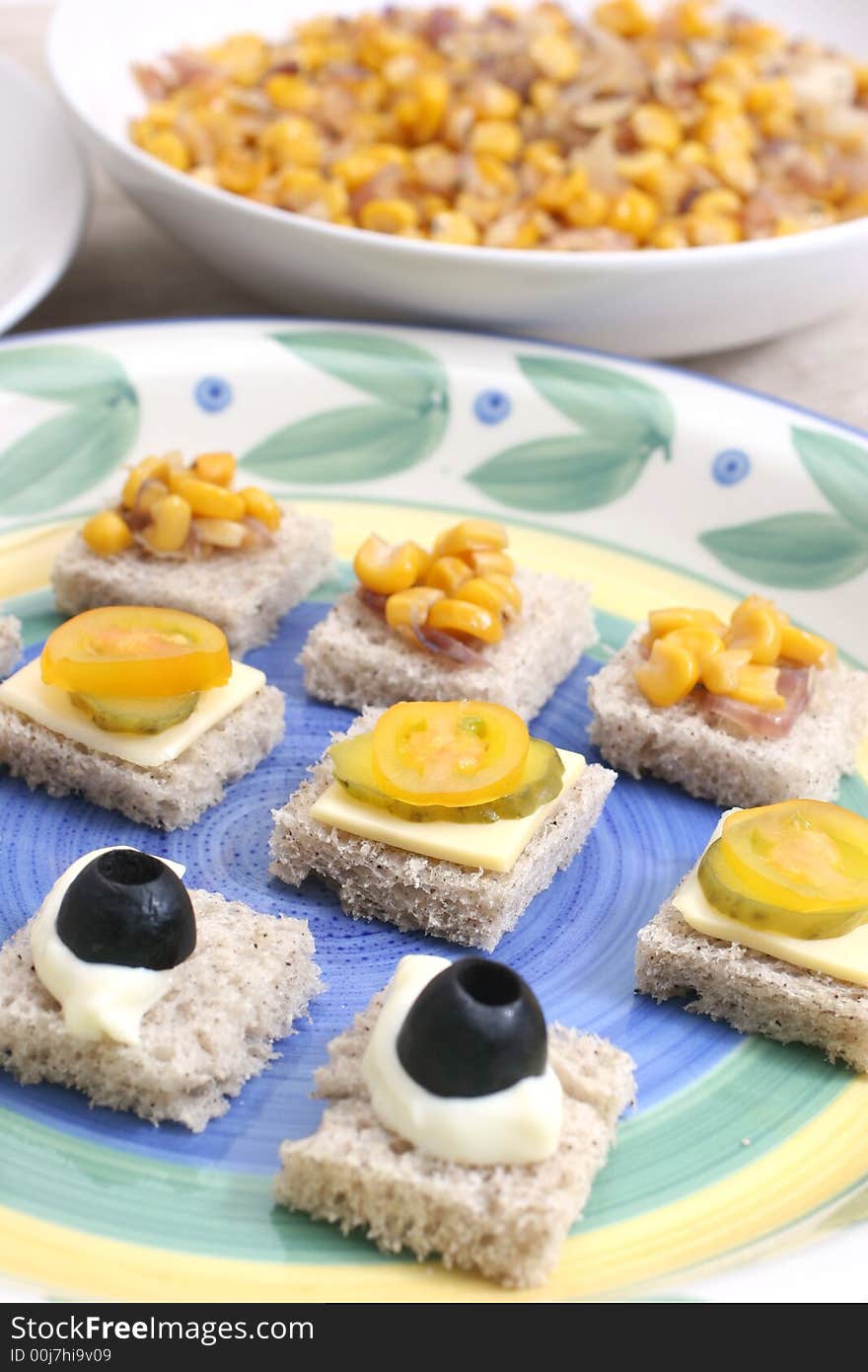 Fruit and vegetable canapes on a colorful nature ceramic plate. Fruit and vegetable canapes on a colorful nature ceramic plate