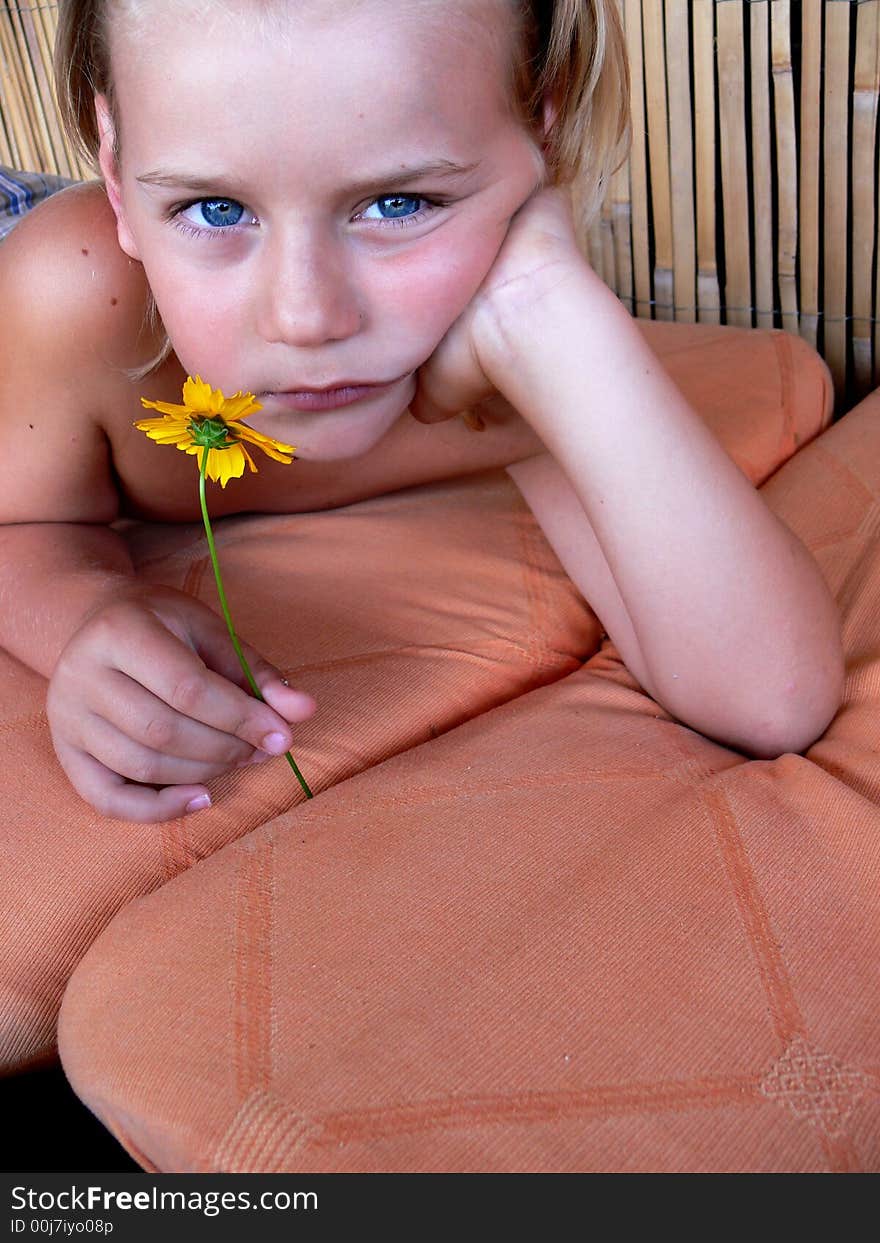 The child with a flower.