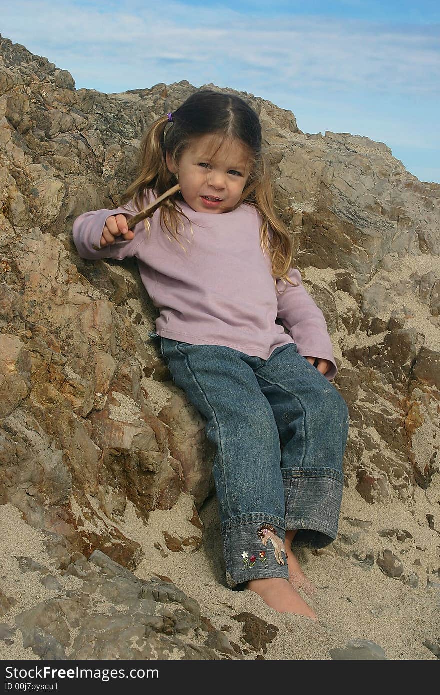 Young girl relaxing at the Oregon coast. Young girl relaxing at the Oregon coast.