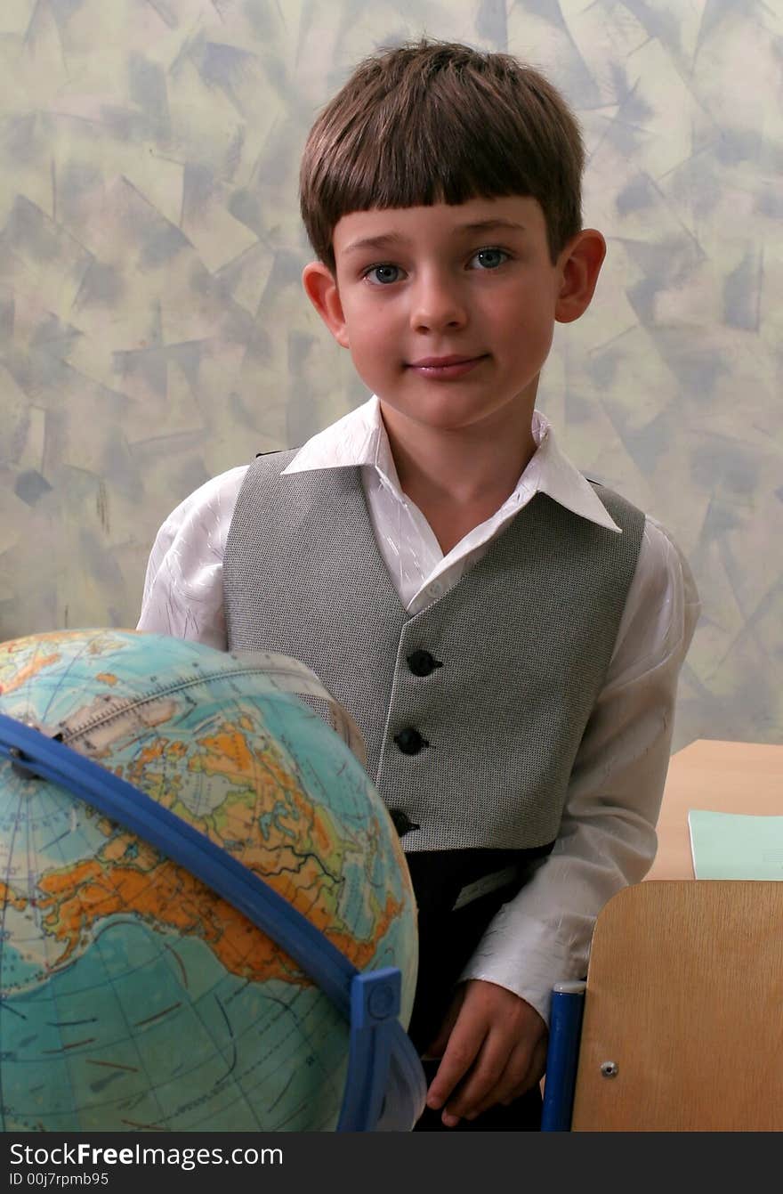 Portrait of the schoolboy with the globe. Portrait of the schoolboy with the globe