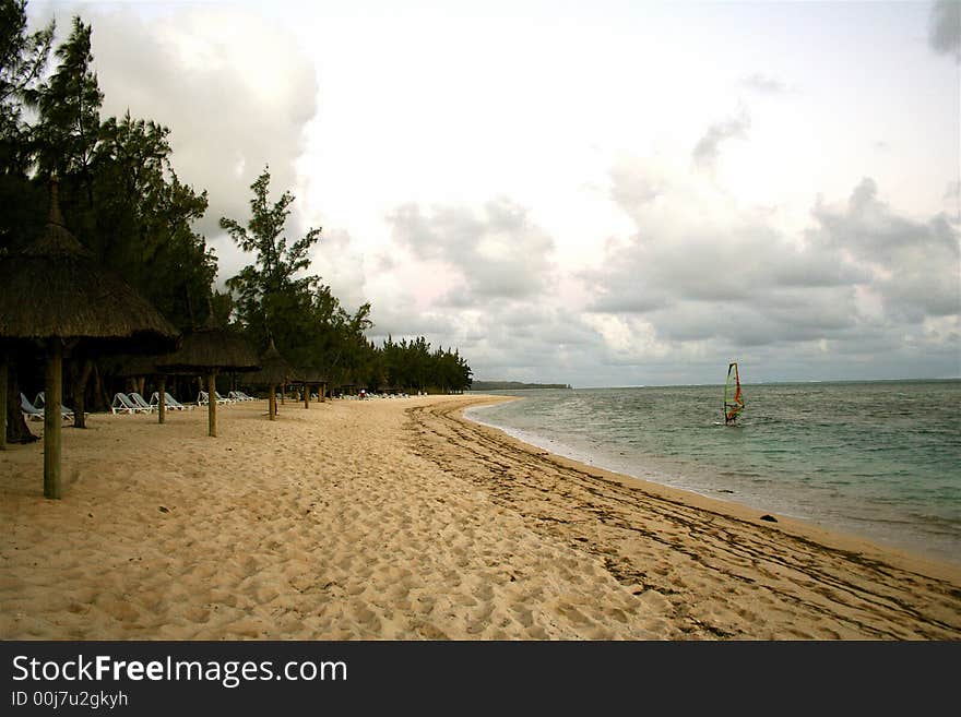 Windsurfing in Mauritius near a lonely beach. Windsurfing in Mauritius near a lonely beach