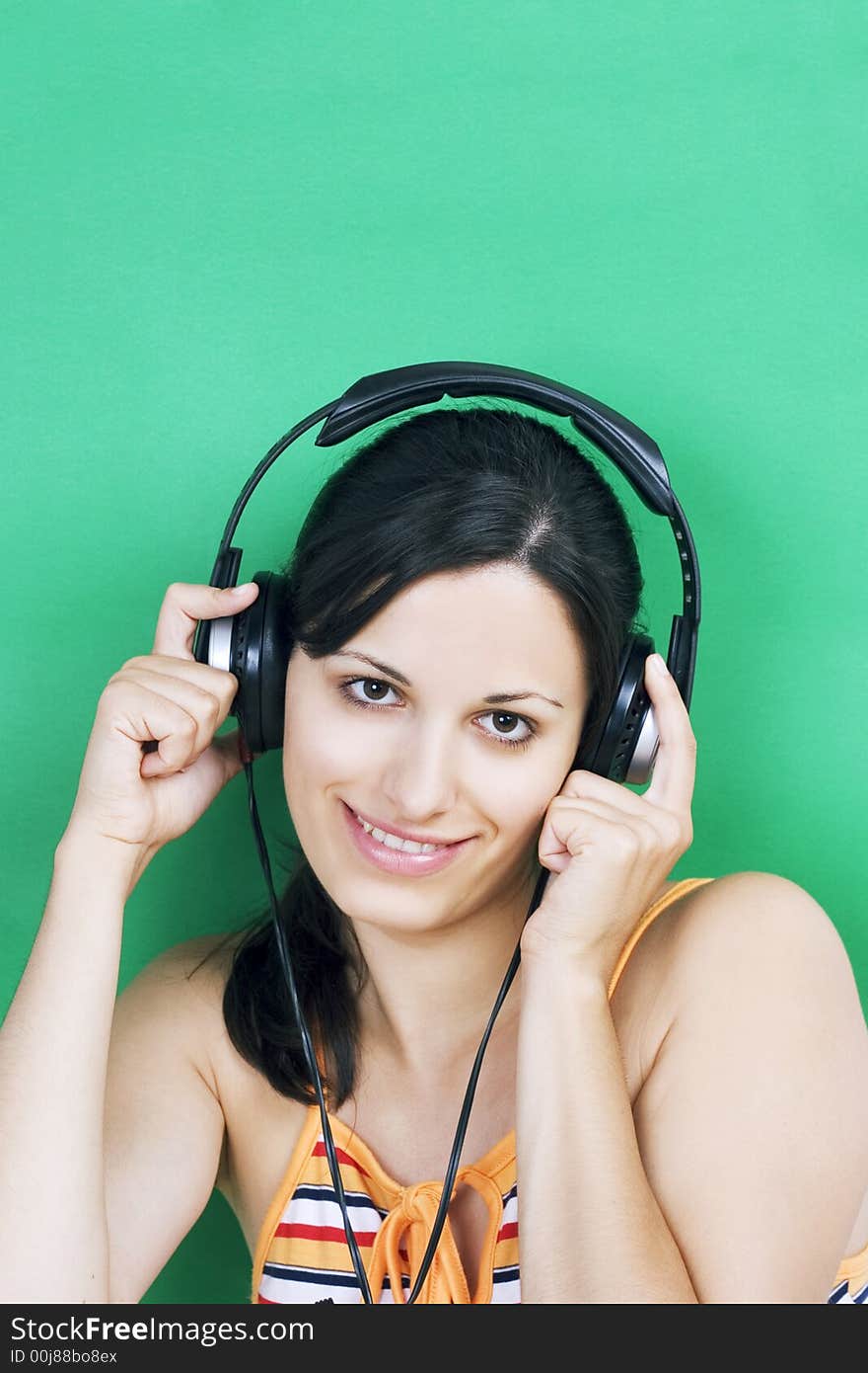 Young beautiful girl listening music