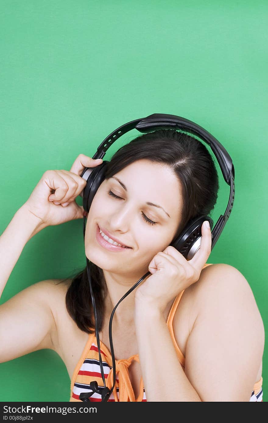 Young beautiful girl listening music