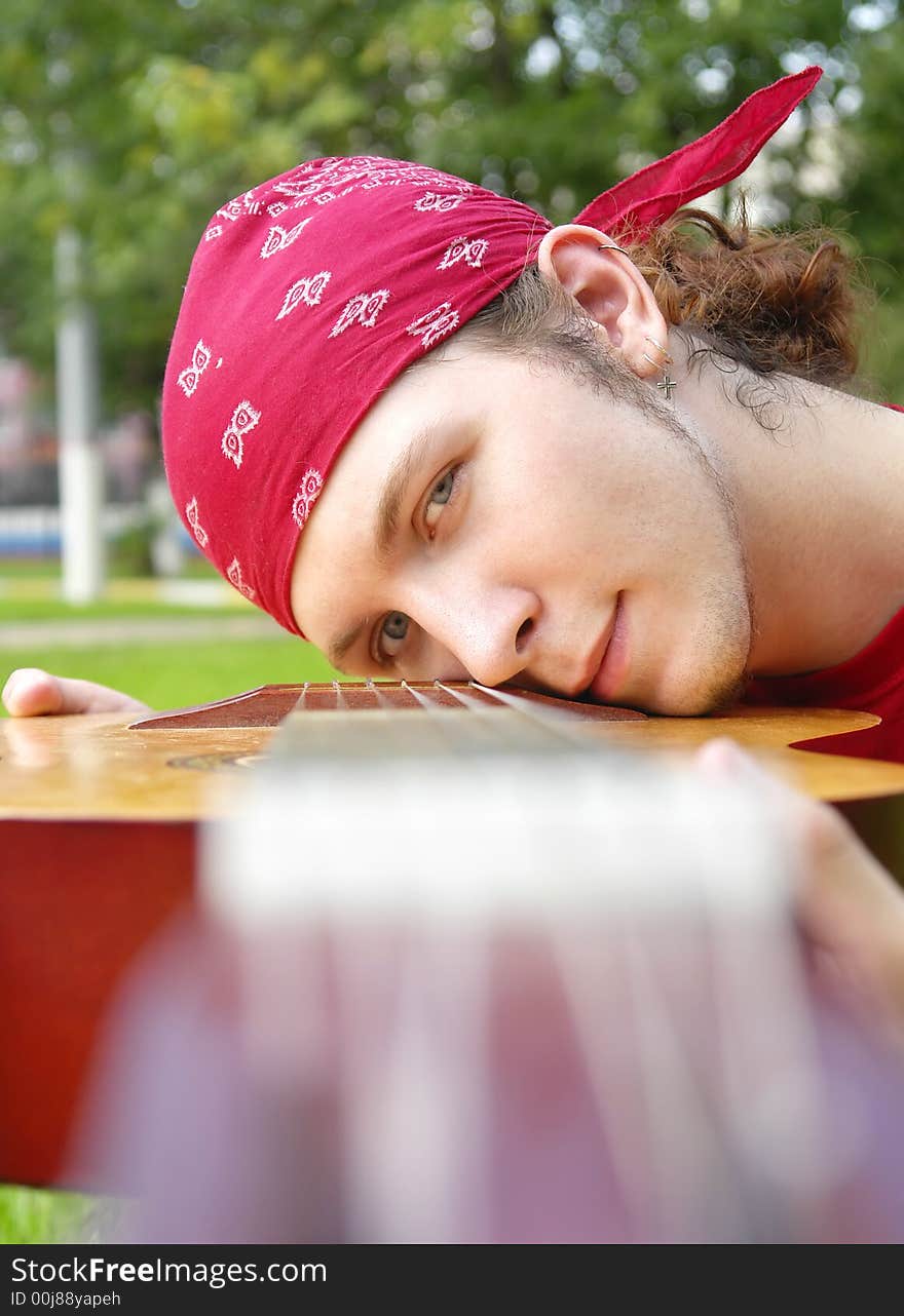 Teenage boy with a guitar