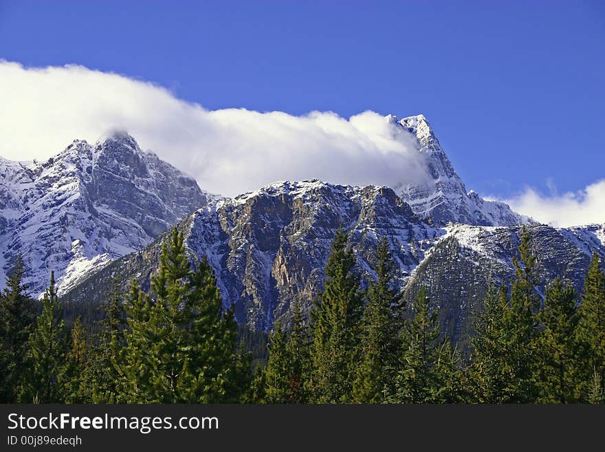 Cloud cover clinging to the side of a mountain. Cloud cover clinging to the side of a mountain.