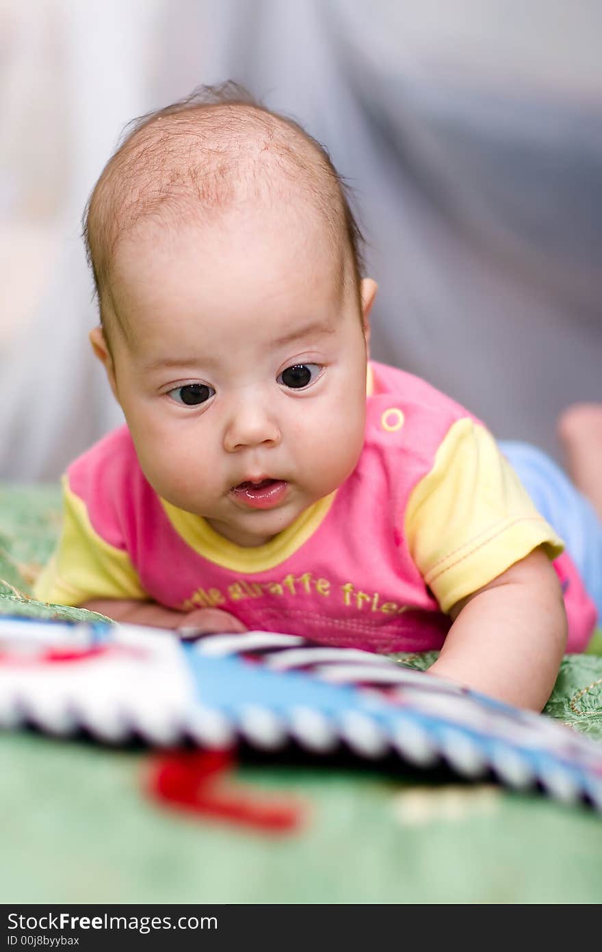 Baby girl crawls on bed. Baby girl crawls on bed