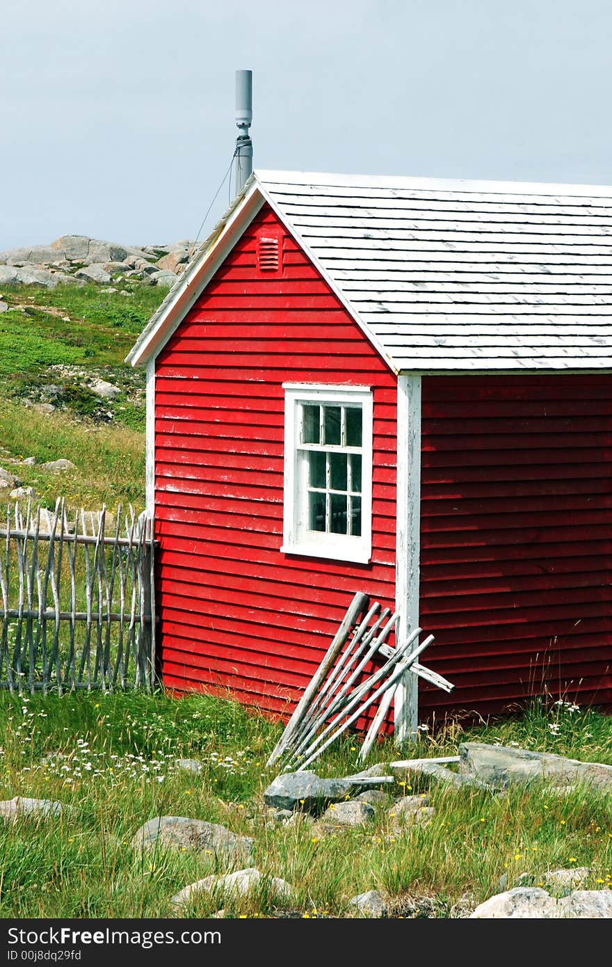 Rustic red building on the Bonavista Lighthouse grounds in Newfoundland, Nova Scotia, Canada - travel and tourism.