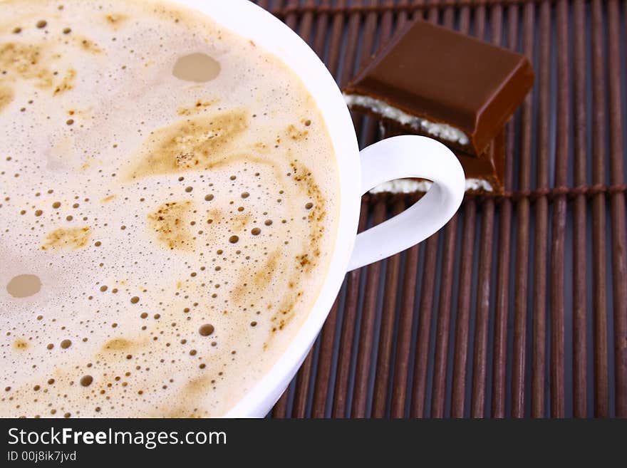 Cup of coffee with chocolate Frothy cappuccino coffee.