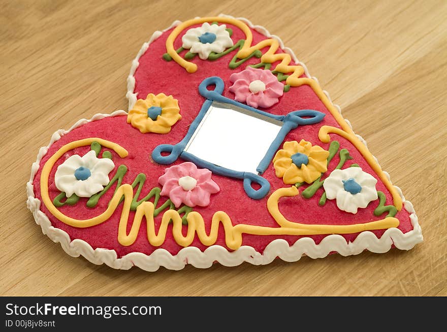 Gingerbread heart on a wooden board