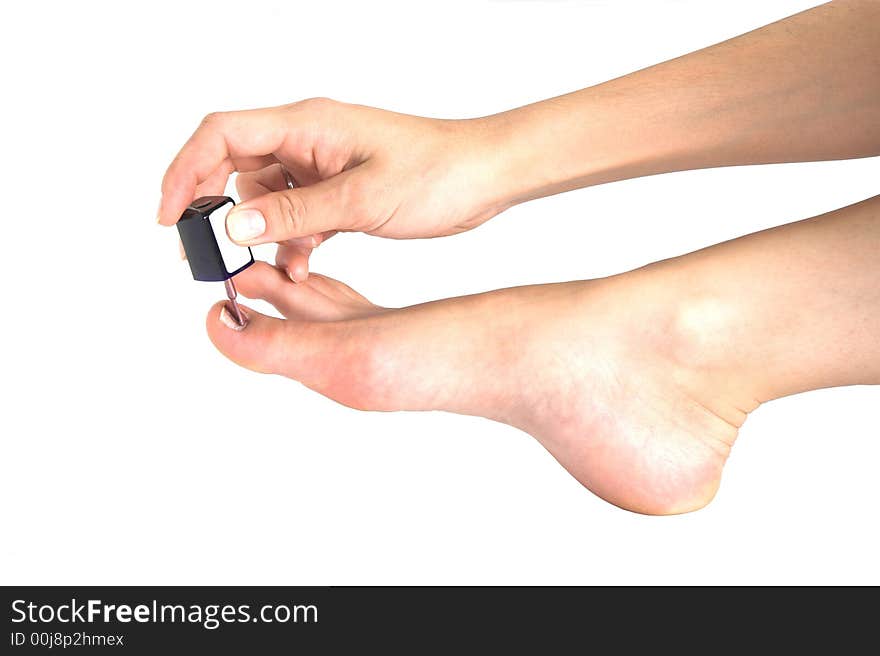 Woman applying nail polish on