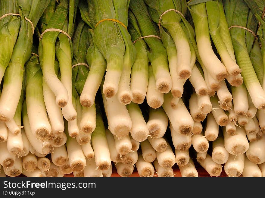 A display of green onions at an outdoor market in Ottawa, Canada