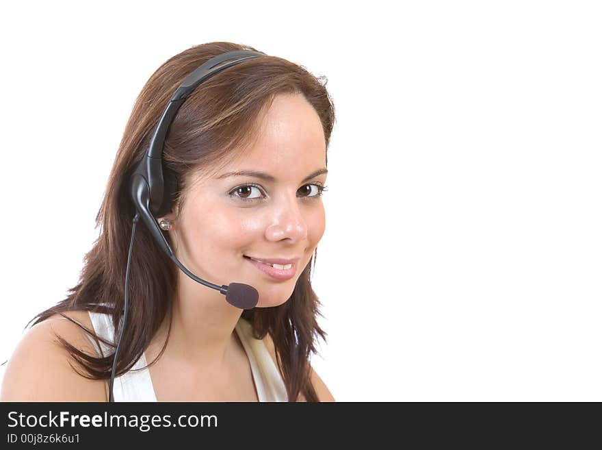 Beautiful customer representative with headset smiling during a telephone conversation - over a white background. Beautiful customer representative with headset smiling during a telephone conversation - over a white background