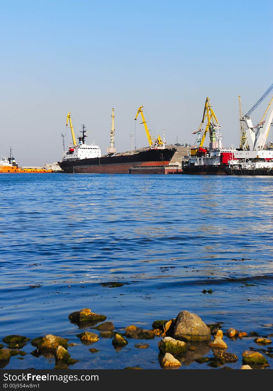 The trading ships in port. Picturesque coast of ocean