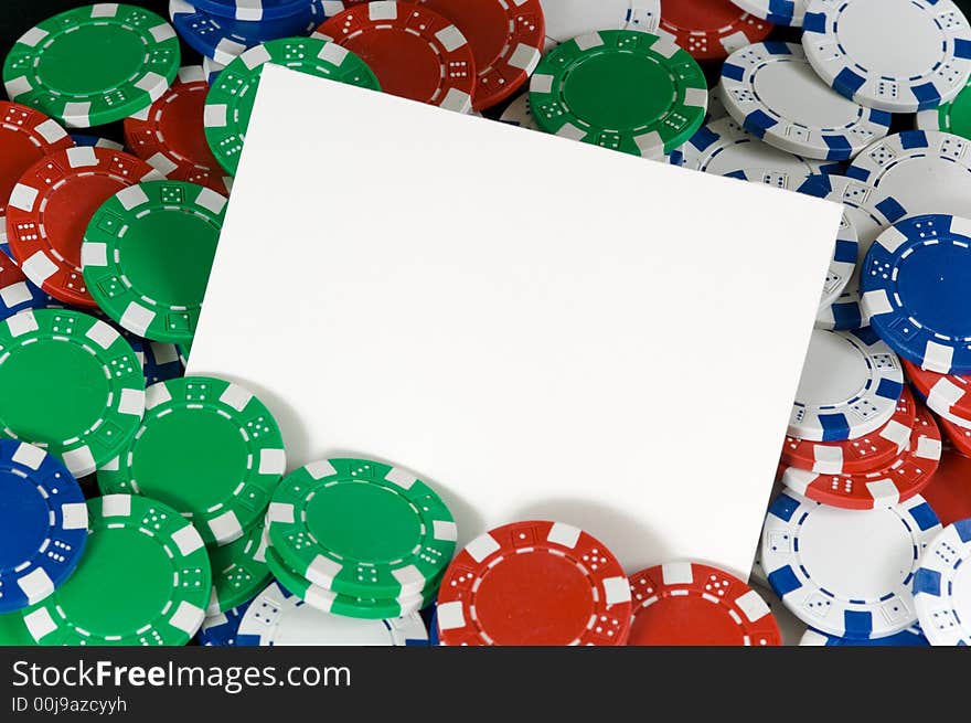 Blank notecard surrounded by poker chips - copy space  add text or graphic to card, for invitation, or announcement