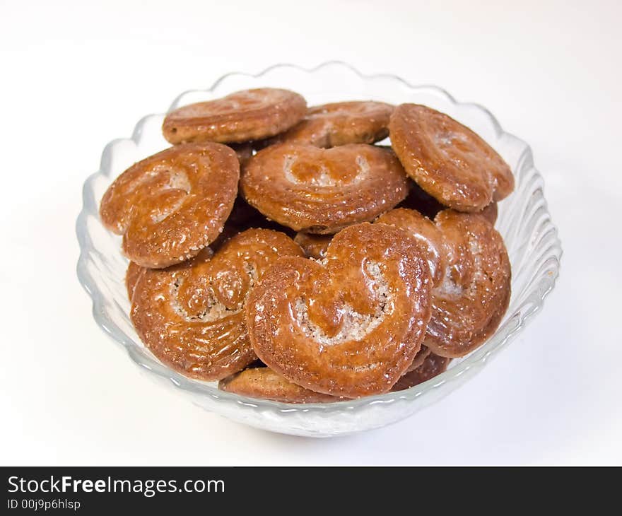 Chocolate cookies in a plate on white background