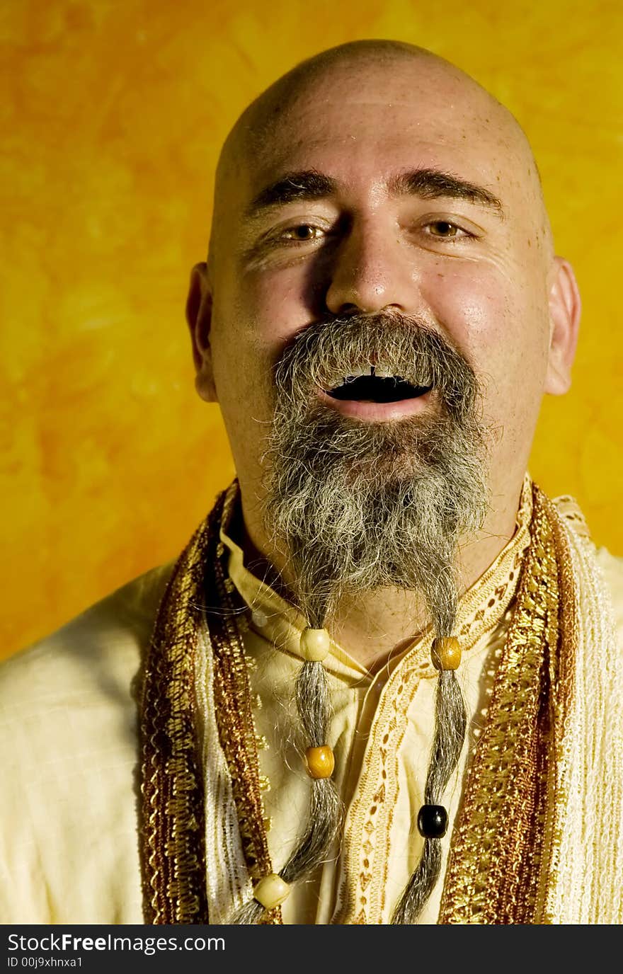 Funny bald guru with a long beaded beard. Funny bald guru with a long beaded beard.