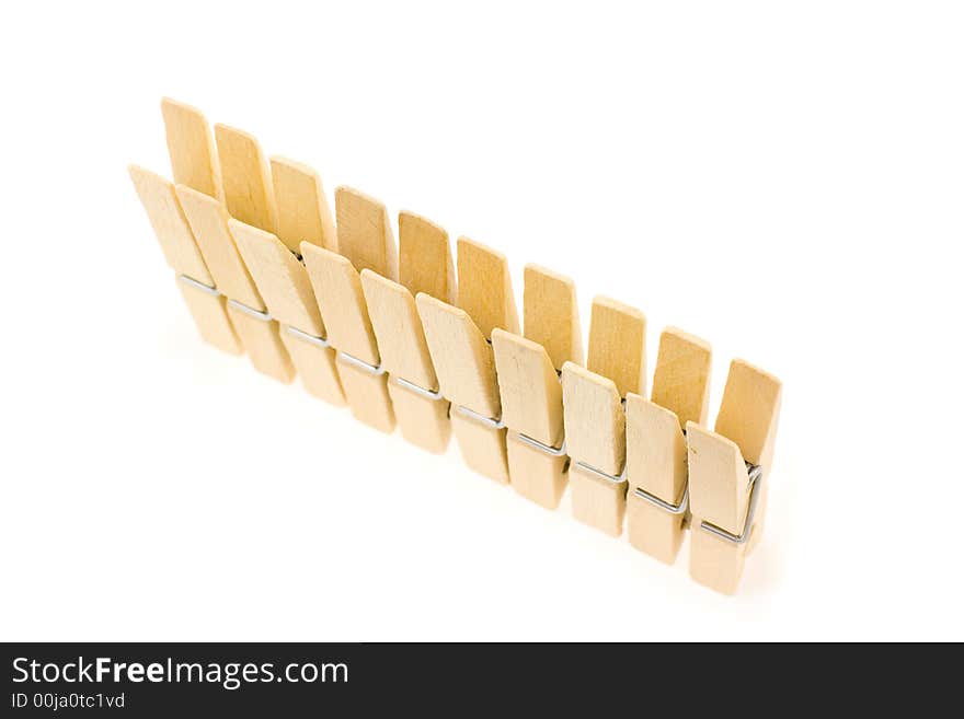 Block of wooden clothespins in a line. Block of wooden clothespins in a line