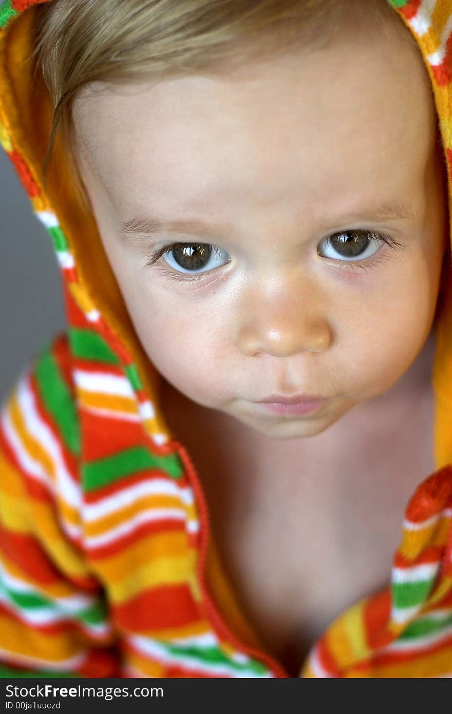 Image of cute toddler wearing a hooded jacket