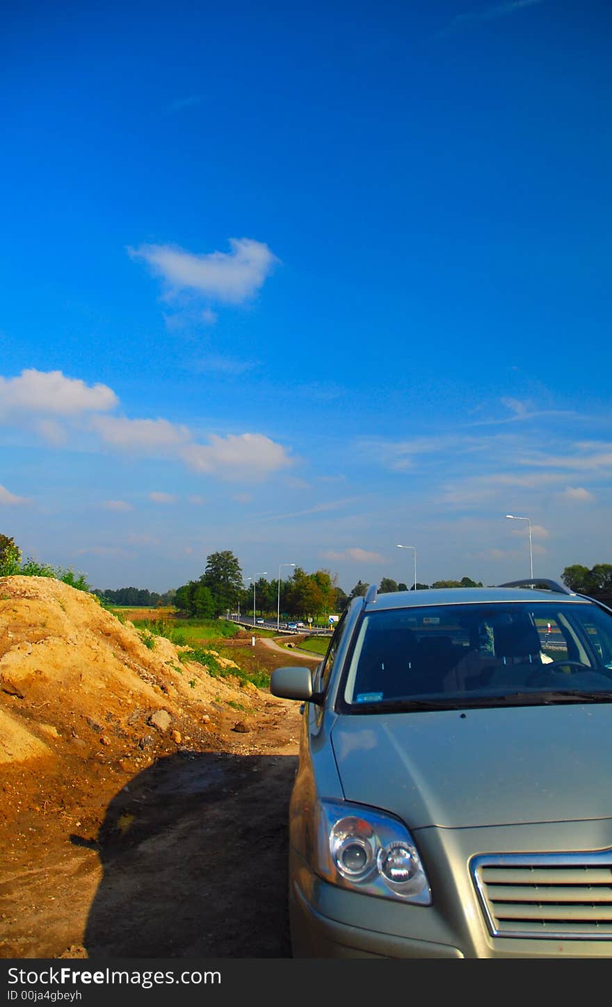 Car on countryside with blue sky scenery. Car on countryside with blue sky scenery