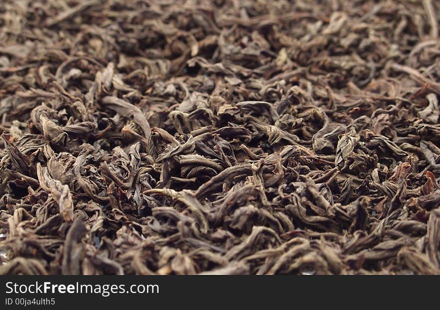 Black textured tea. focus in center only.