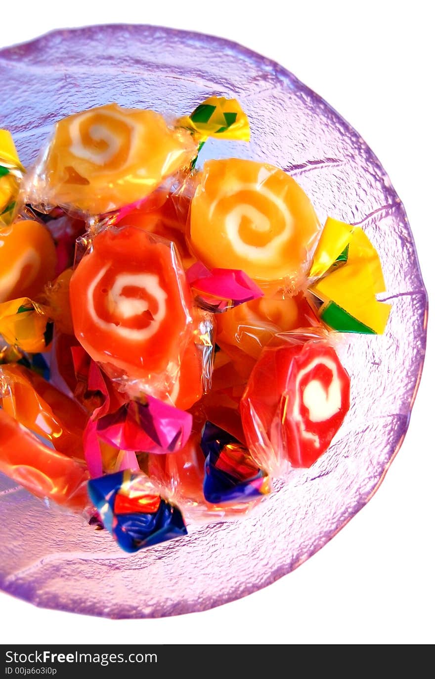 Glass plate full of colorful sweets. Glass plate full of colorful sweets