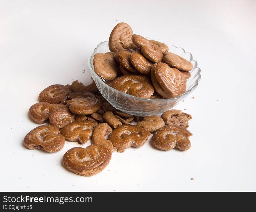 Chocolate cookies in a plate on white background. Chocolate cookies in a plate on white background