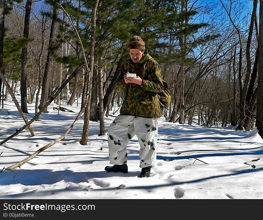 The scientist is on count of amure tiger in far-eastern taiga. Russian Far Easr, Primorye, nature state reserve Lazovsky. The scientist is on count of amure tiger in far-eastern taiga. Russian Far Easr, Primorye, nature state reserve Lazovsky.